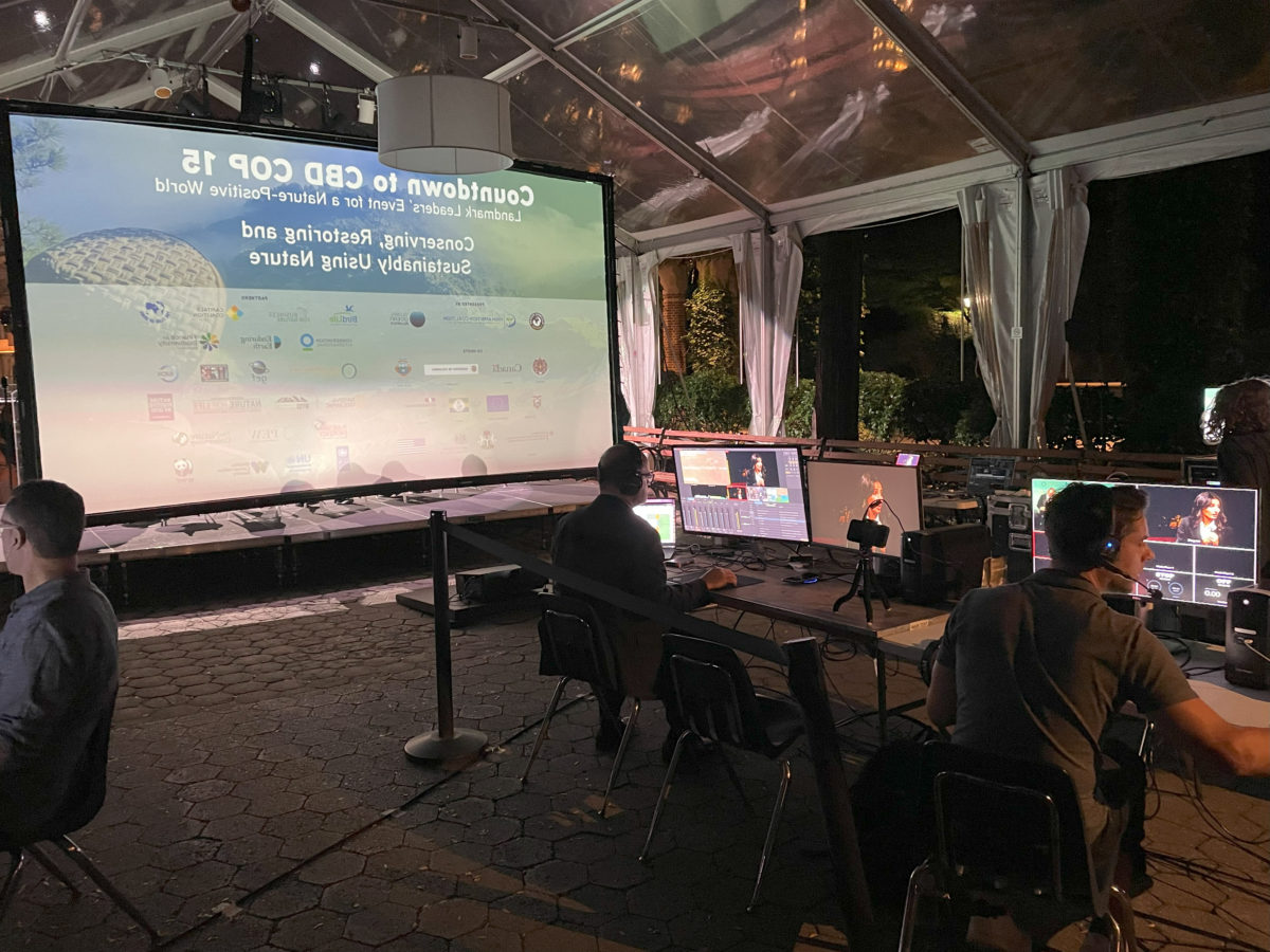 ScalePV event production team at the control desks behind a live stage